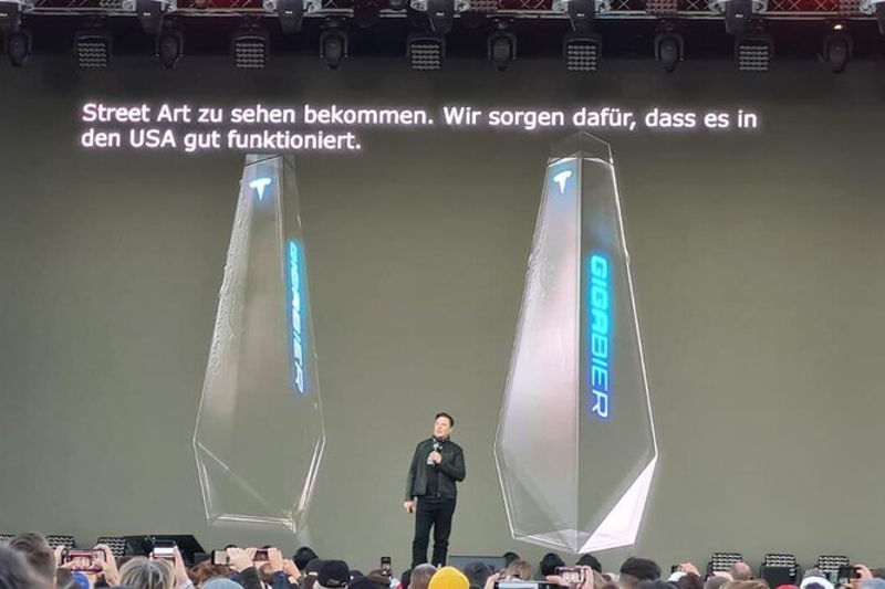 Elon Musk introducing Tesla's new 'Giga Bier' at the Oct. 9 Giga Fest at the Gigafactory at the Berlin-Brandenburg County Fair.