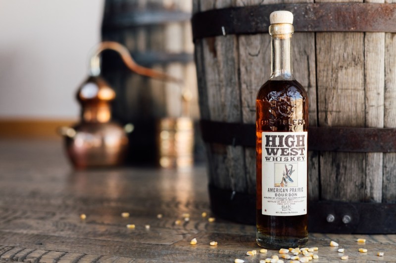 A bottle of High West behind a barrel.