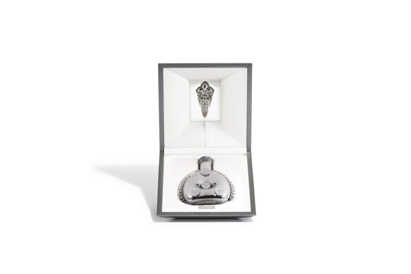 A bottle of Remy Martin Louis XIII Black Pearl Grande Champagne Cognac in its casing.