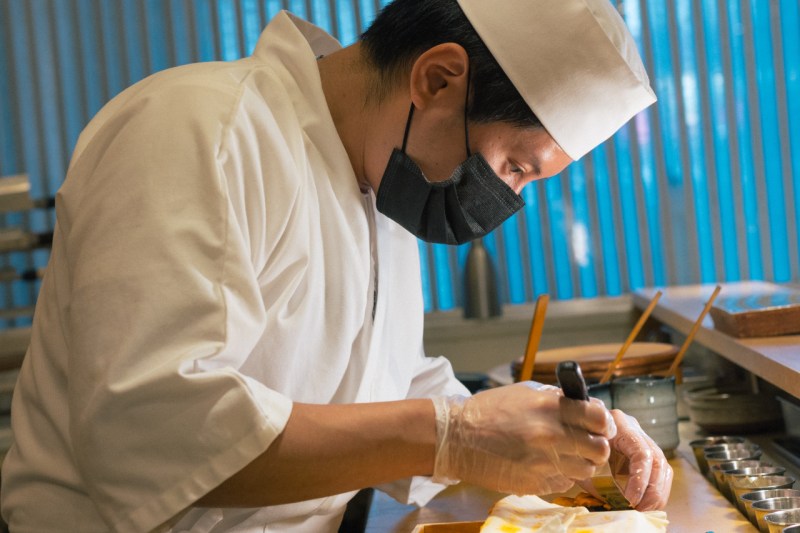 Chef Jay Zheng of Koyo cooking.