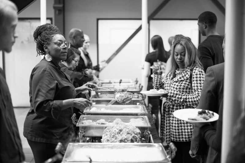 Chef Rene Johnson serving food.