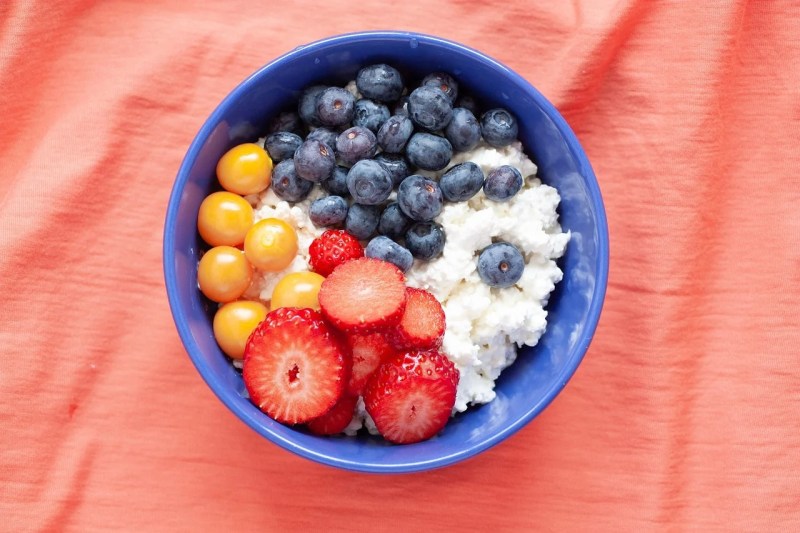Cottage cheese and berries in a bowl.