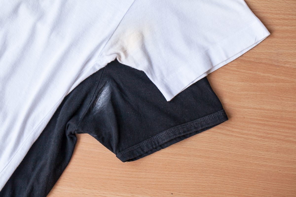 White and black shirts with deodorant stains.