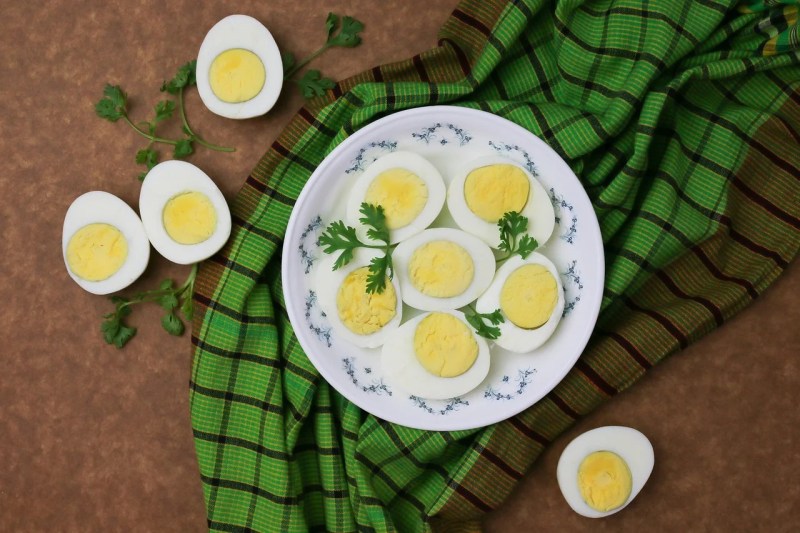 hard-boiled eggs on a plate and the counter.