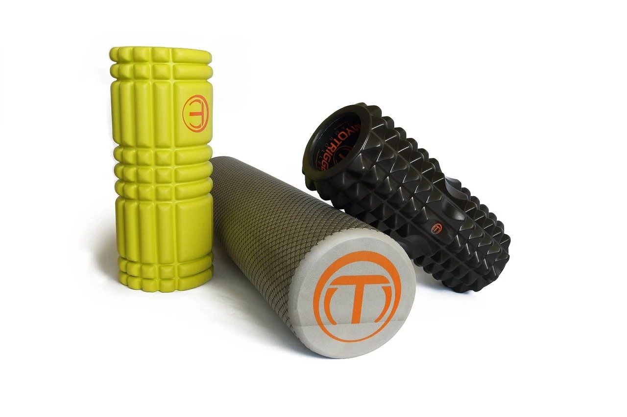 three foam rollers stacked up against each other.