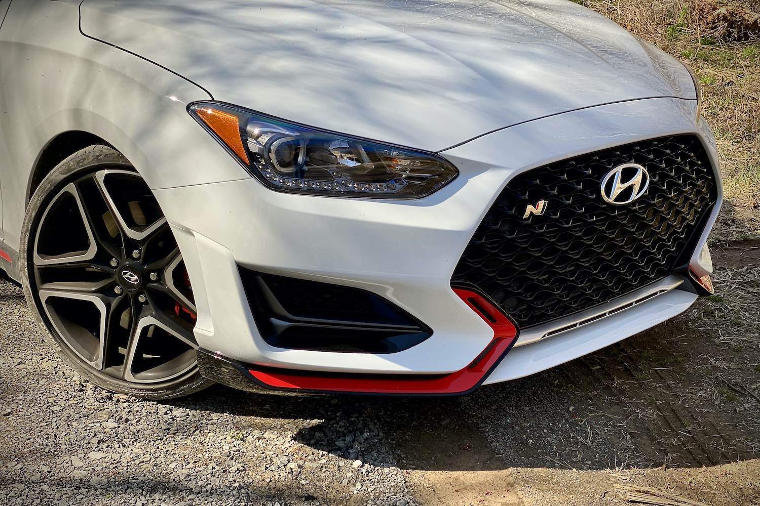 Hyundai Veloster N close up of left front headlight and air vent.