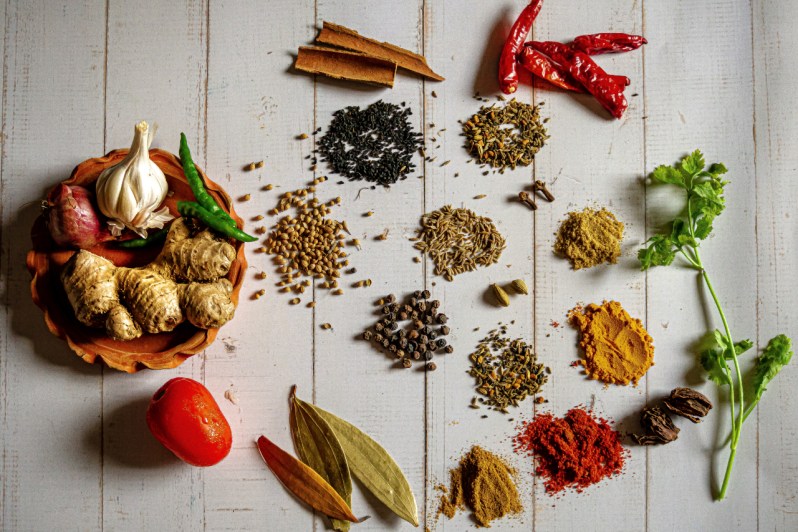Array of Indian spices on table.