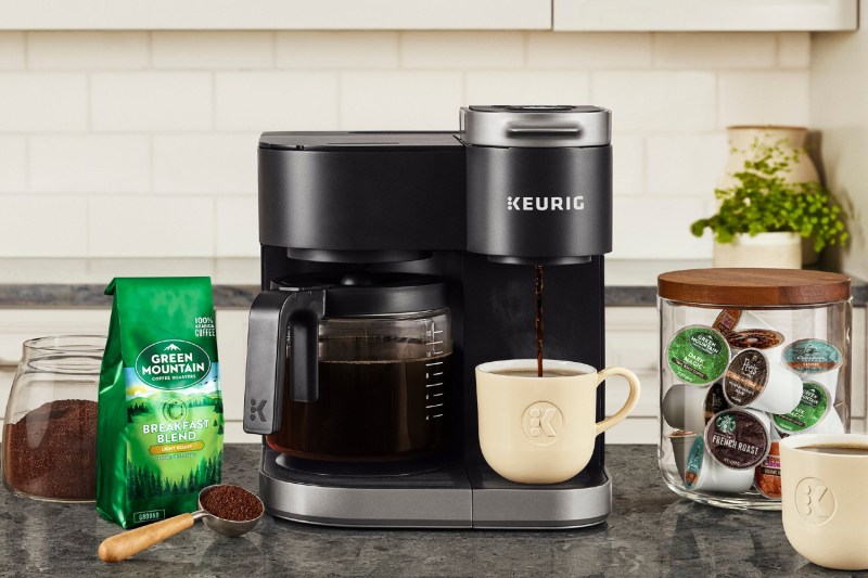 Keurig K-Duo Single Serve K-Cup Pod and Carafe Coffee Maker on a counter with coffee.