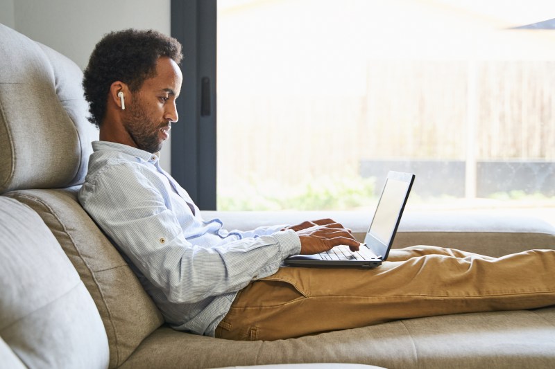 Man sitting at home working