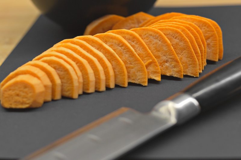 Sliced raw sweet potato.
