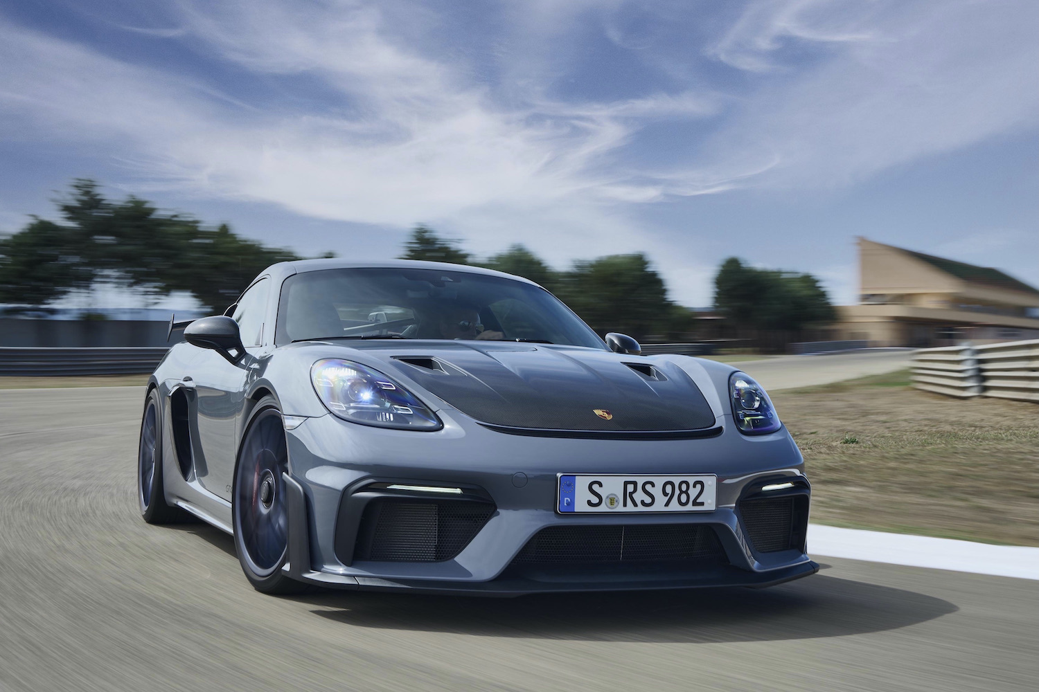 Porsche 718 Cayman GT4 RS front end close up from passenger side on track.
