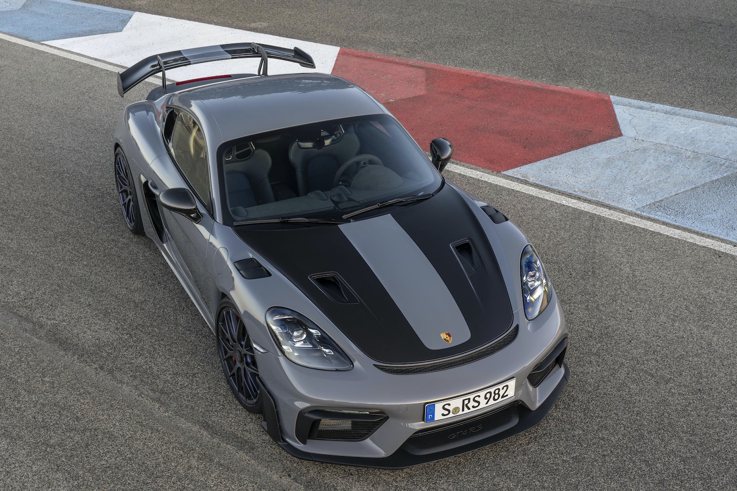 Porsche 718 Cayman GT4 RS front end from top on track.
