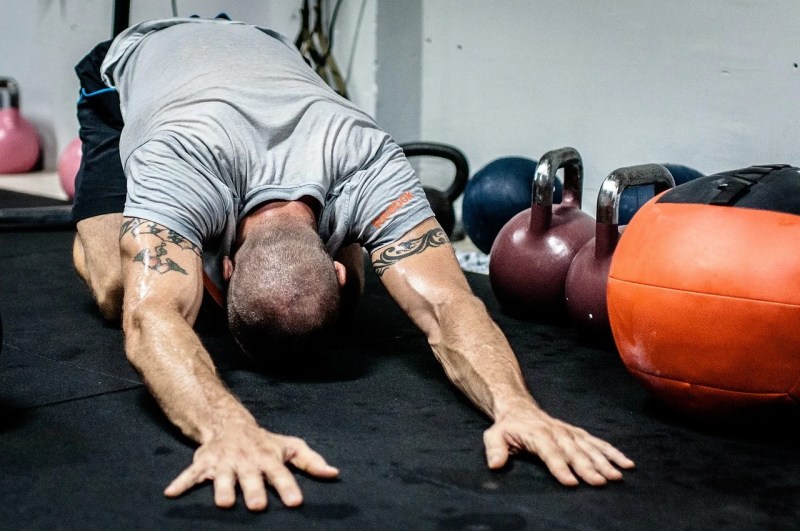 Man doing child's pose stretch