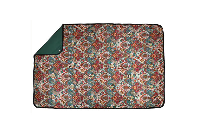 A blanket with a Boho-inspired print.