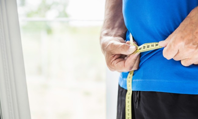 Person measuring waist