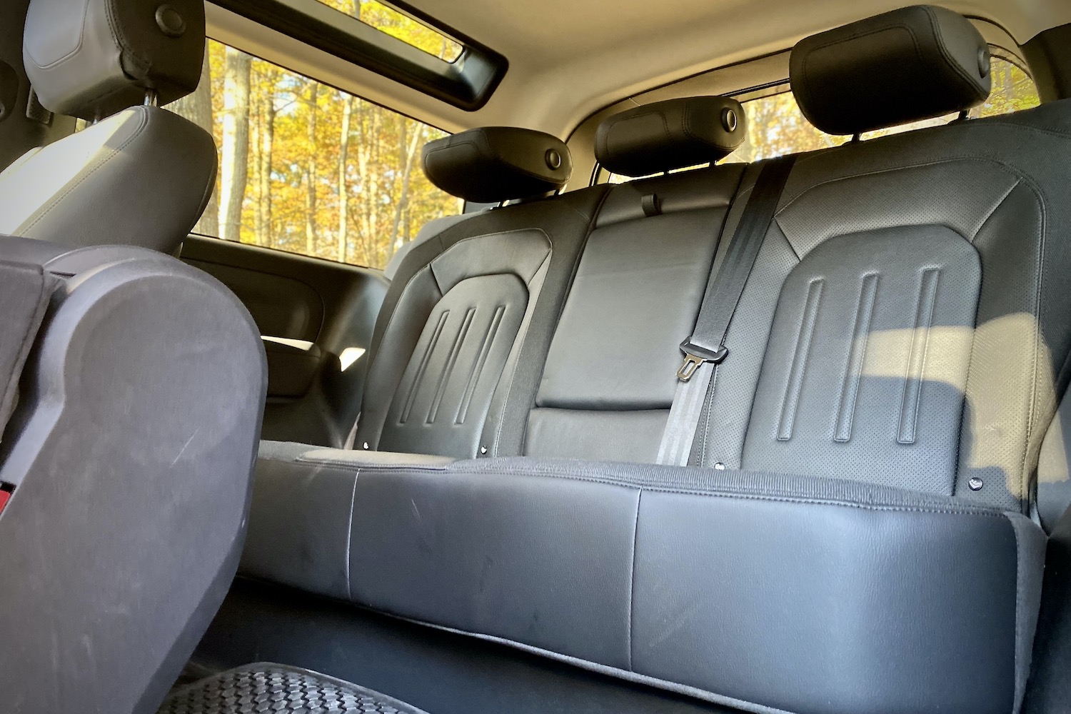Rear seats in Land Rover Defender from driver's side.