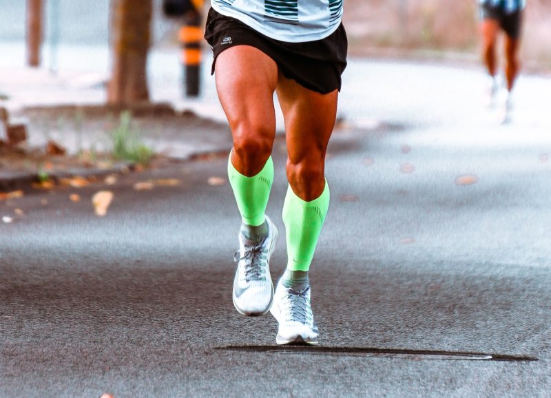 Runner wearing compression socks during a race.