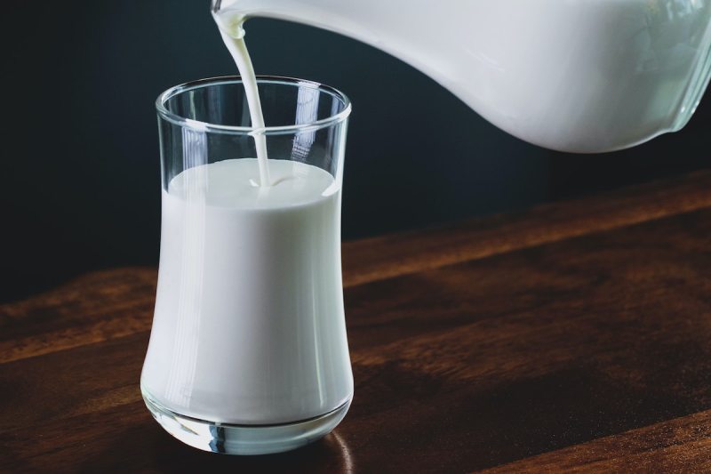 Glass of milk being poured.