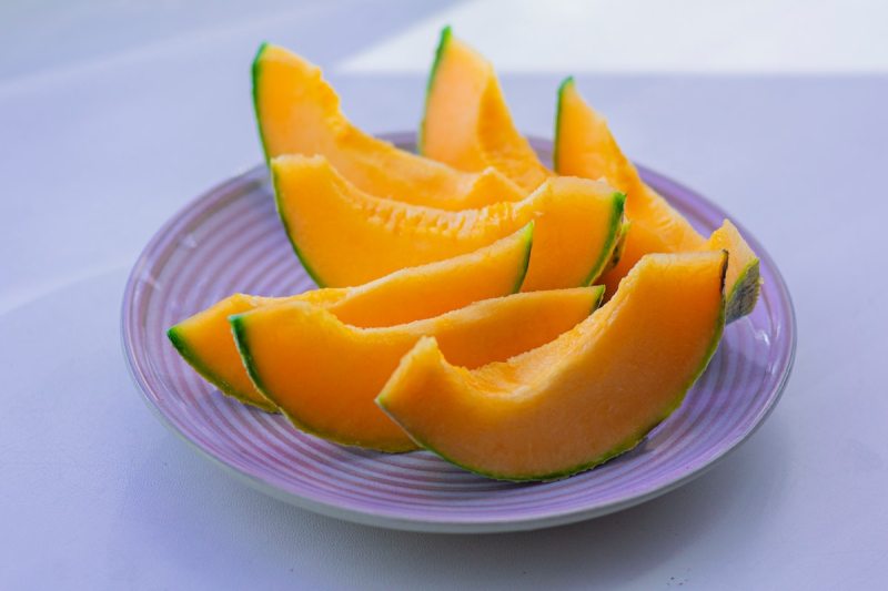 sliced cantaloupe on a plate.