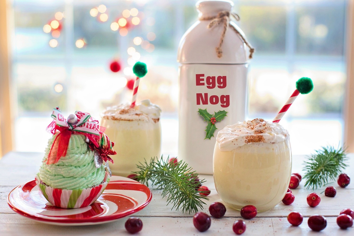 Eggnog bottle, eggnog drink, and a cupcake.