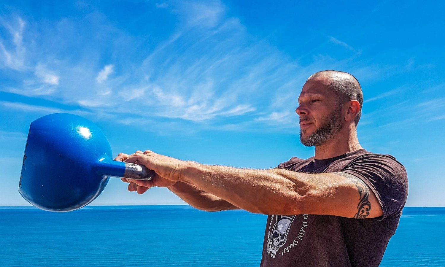 Man doing kettlebell swings