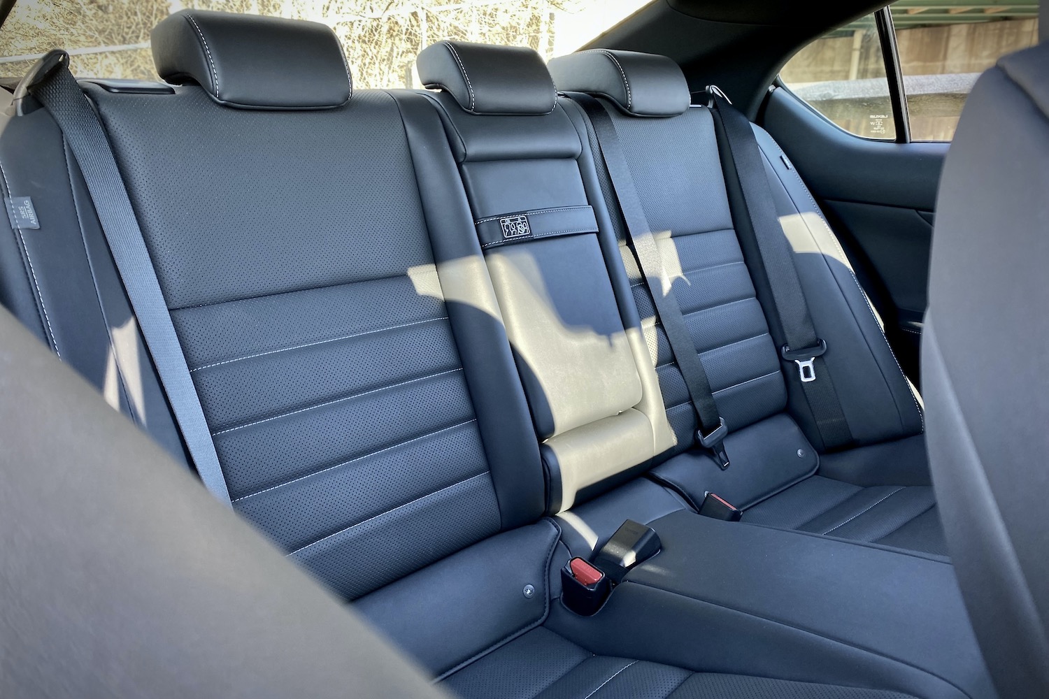 Lexus IS 500 rear seats from passenger's side.