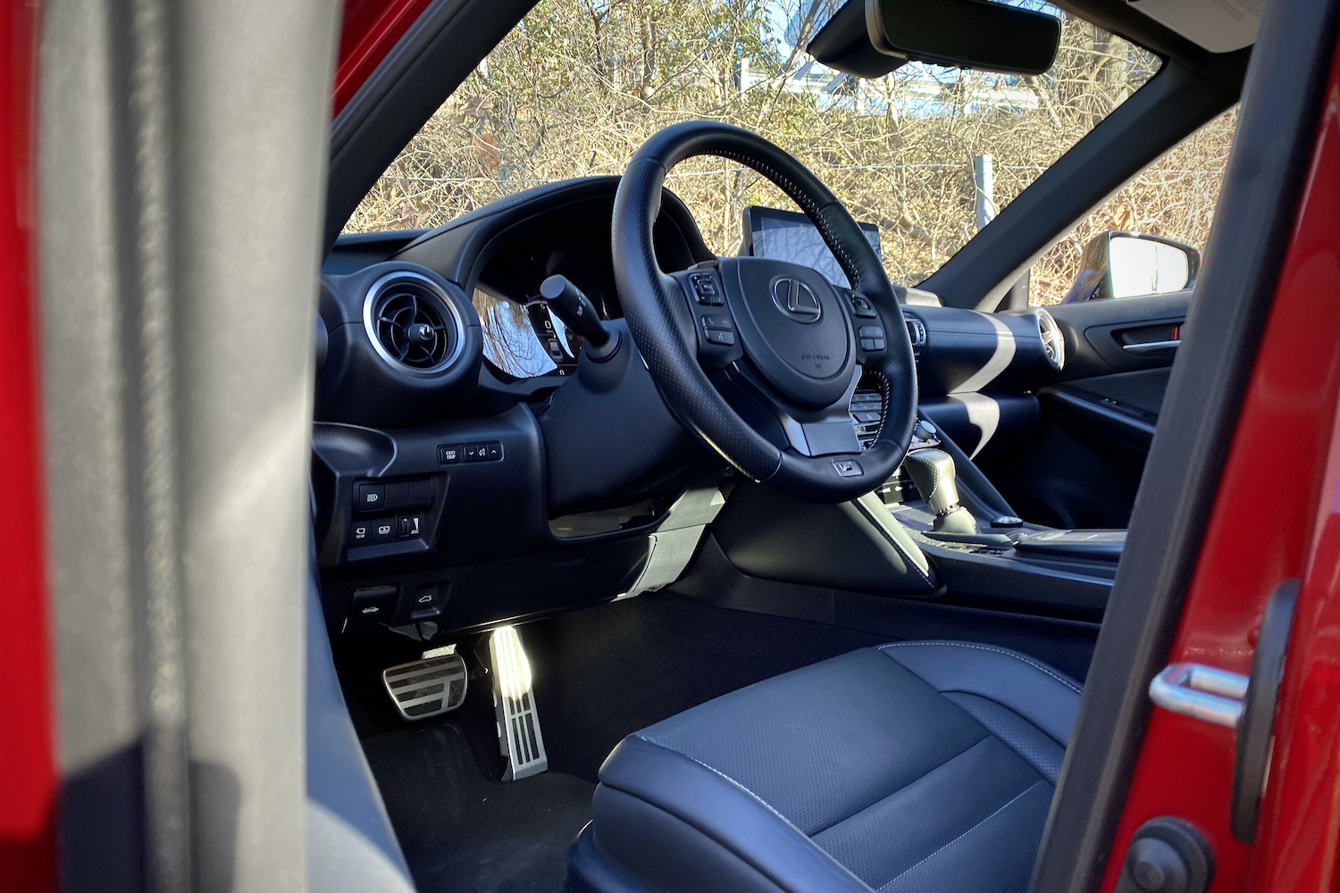 Close up of Lexus IS 500 steering wheel from outside driver's side.