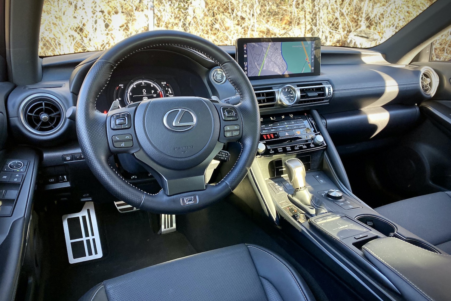 Close up of steering wheel in Lexus IS 500 from driver's side.