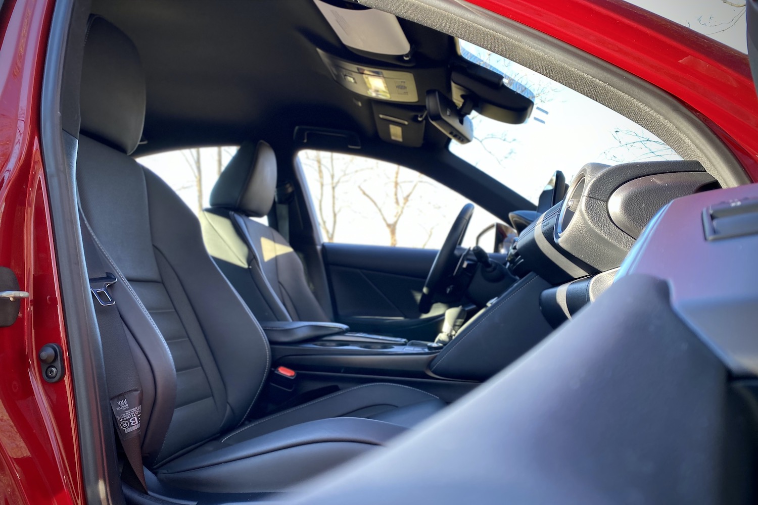 Side view of front seats in Lexus IS 500 from passenger's side door handle.