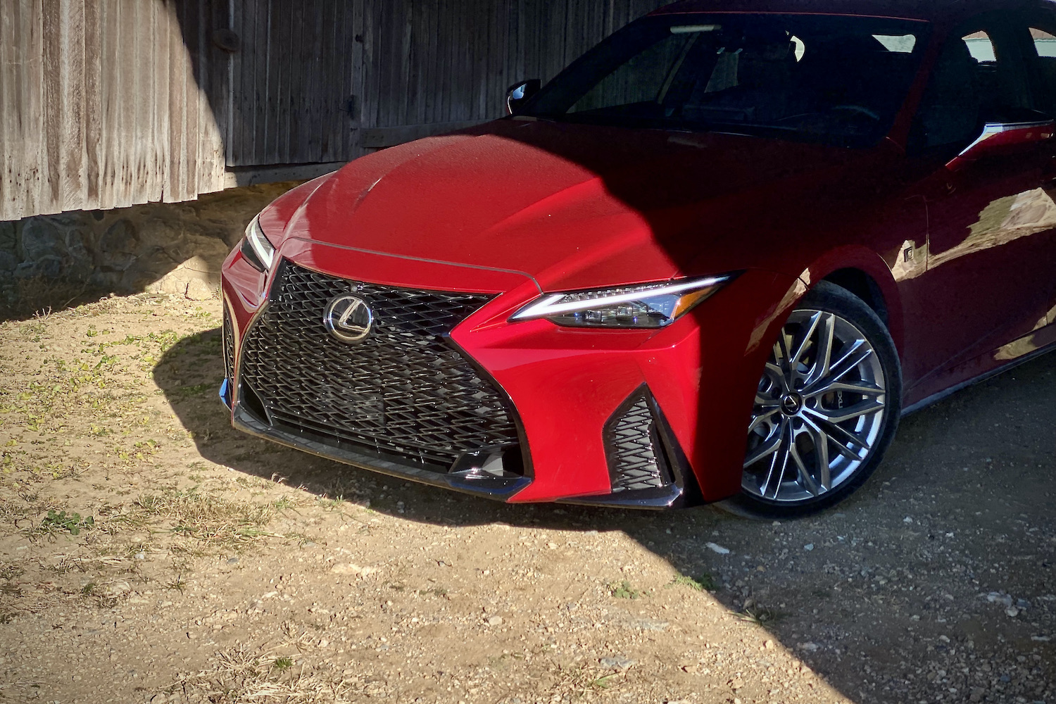 Front end close up of Lexus IS 500 from driver's side in a barn.