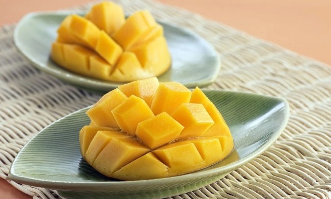 Mango cut open on plates