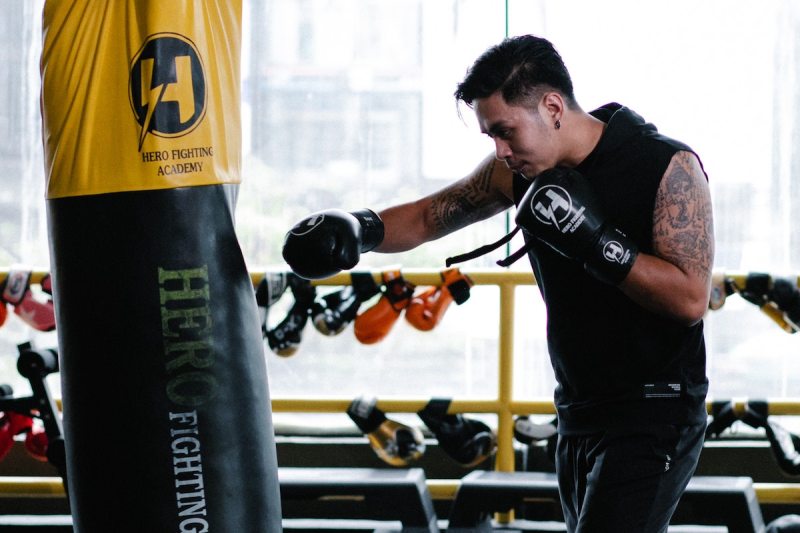 Man hitting a punching bag