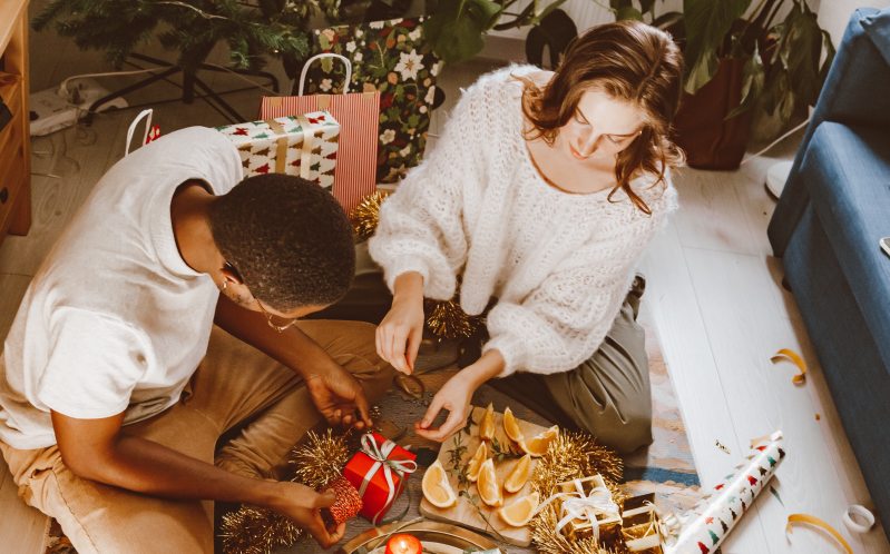 Woman giving man a gift.