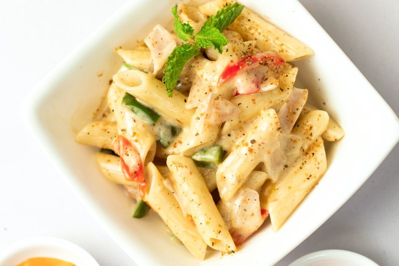 White penne pasta in a bowl