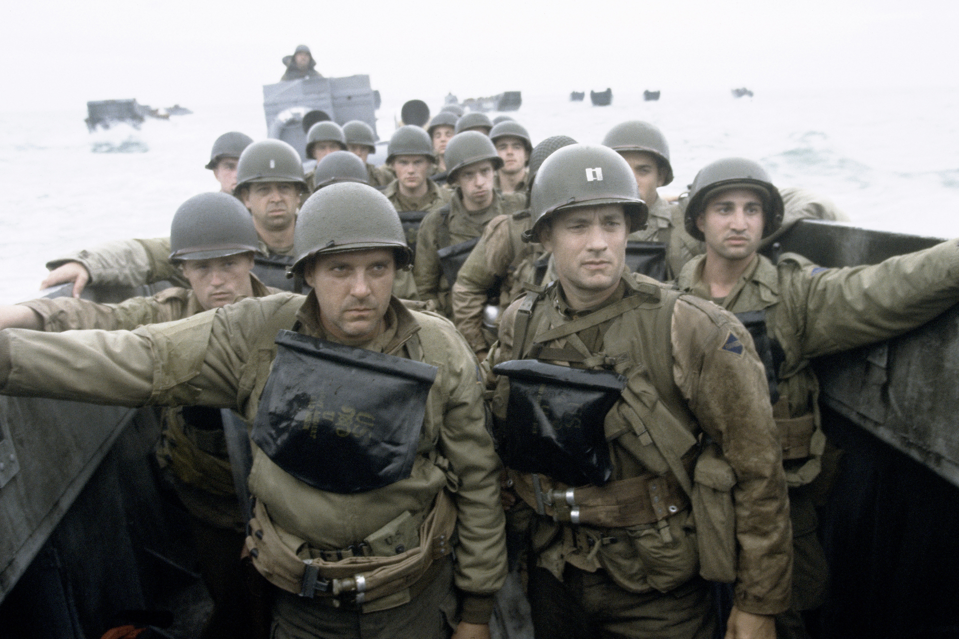 Tom Hanks, Tom Sizemore, and other actors playing as American soldiers riding a boat in "Saving Private Ryan."