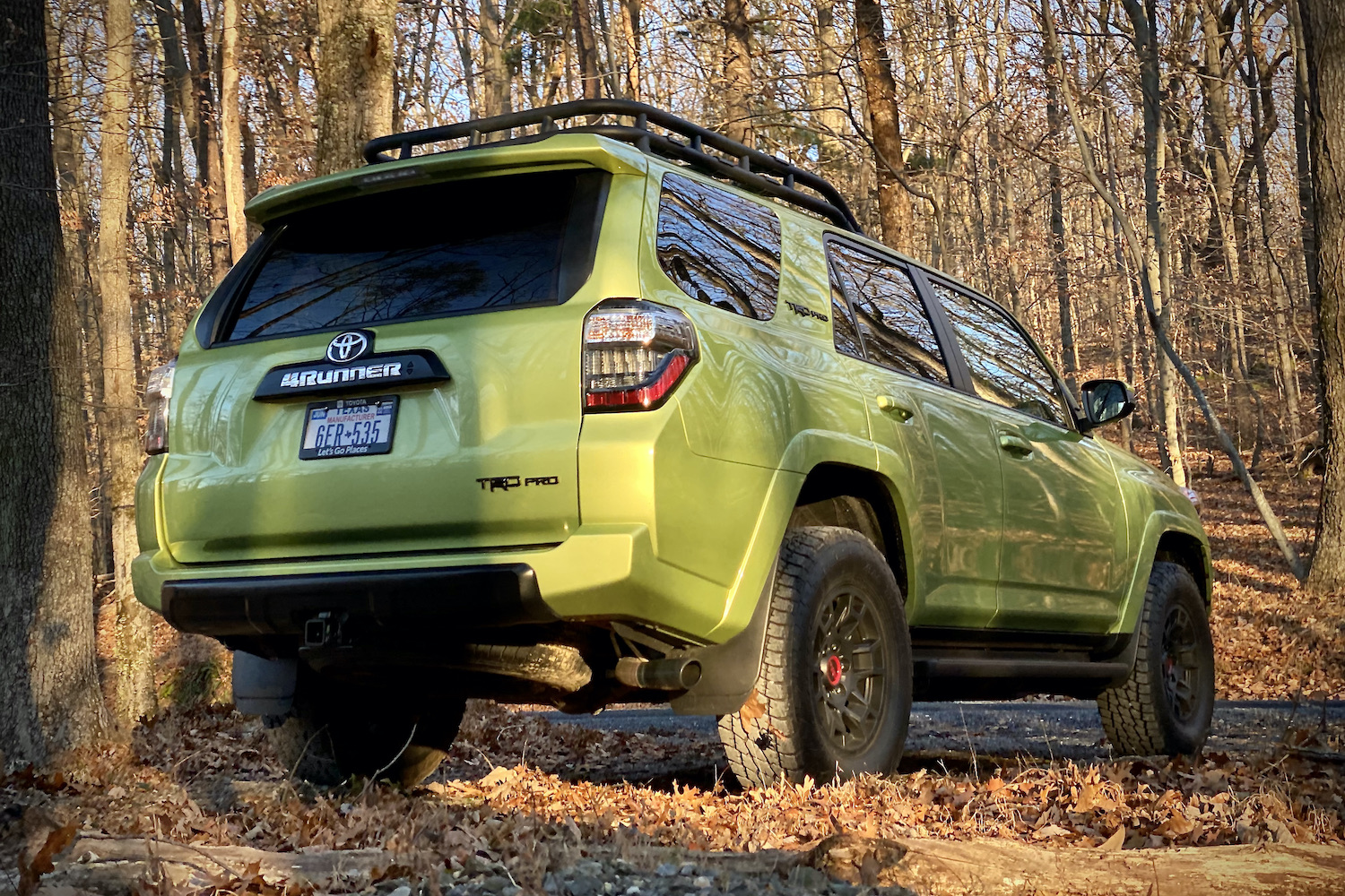 Rear end angle of Toyota 4Runner TRD Pro from passenger's side with leaves.