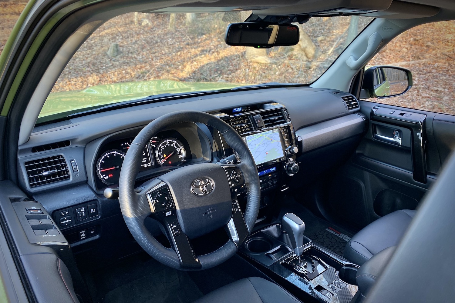Close up of dashboard in Toyota 4Runner TRD Pro from outside with trees in the back.