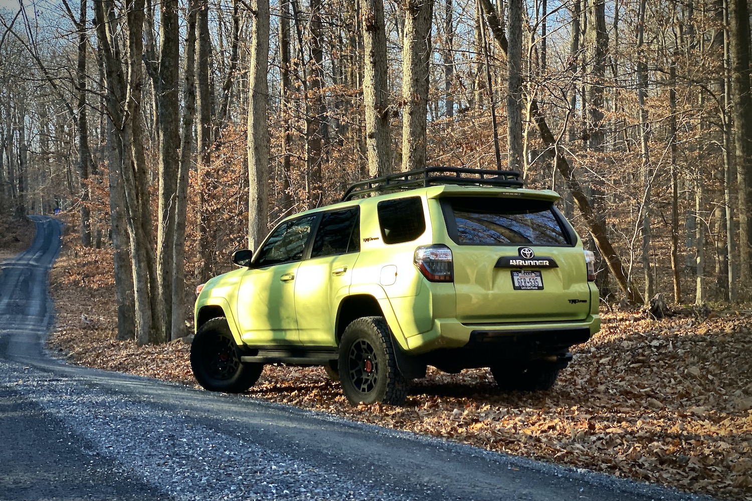 Rear end of Toyota 4Runner TRD Pro from driver's side on gravel path.