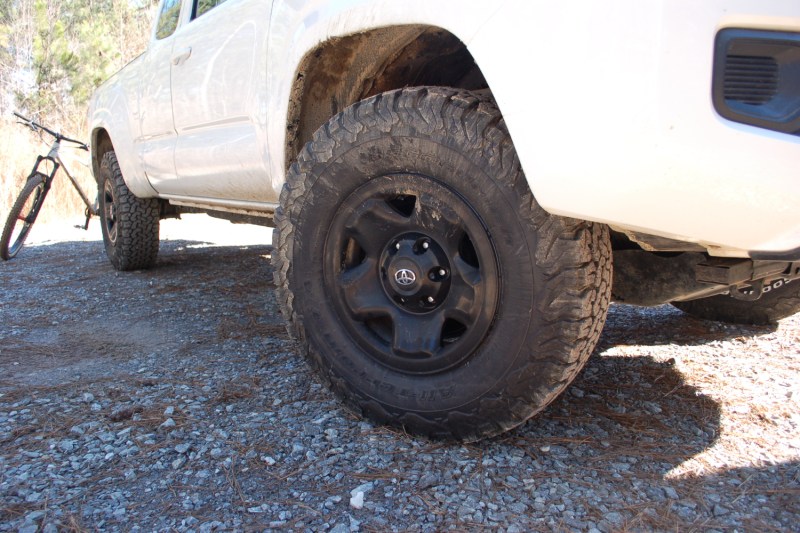 A front view of the BFGoodrich All-Terrain Tire on a white vehicle.