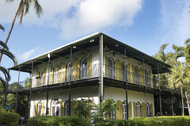 Full building view of the Hemingway House on a clear, sunny day.