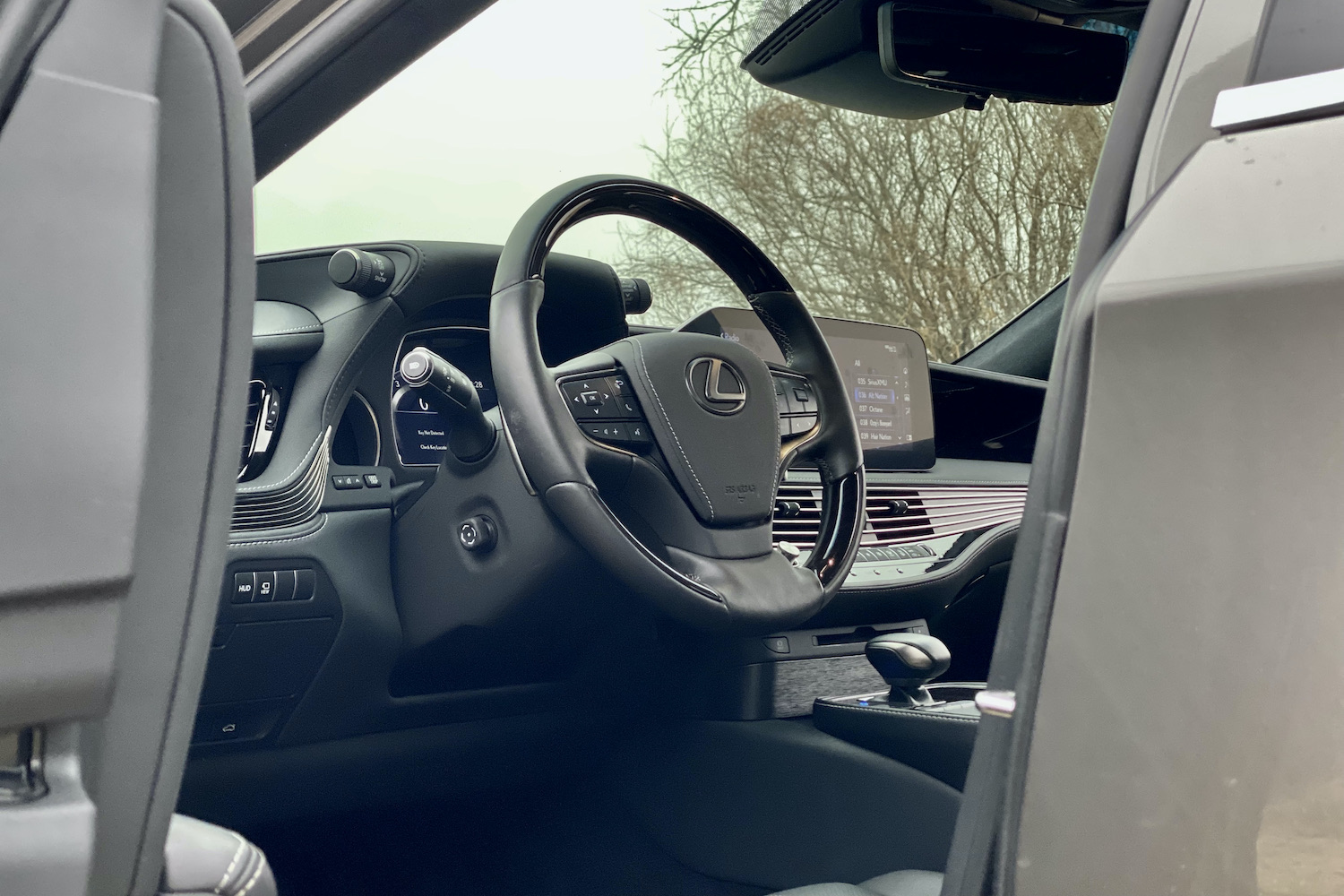 A close-up of the 2021 Lexus LS500's steering wheel from outisde.