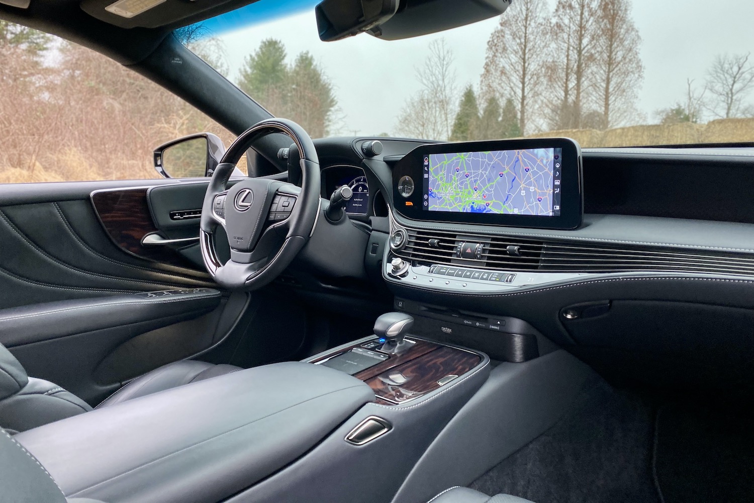 The dashboard and center console of the 2021 Lexus LS500 from rear seats.