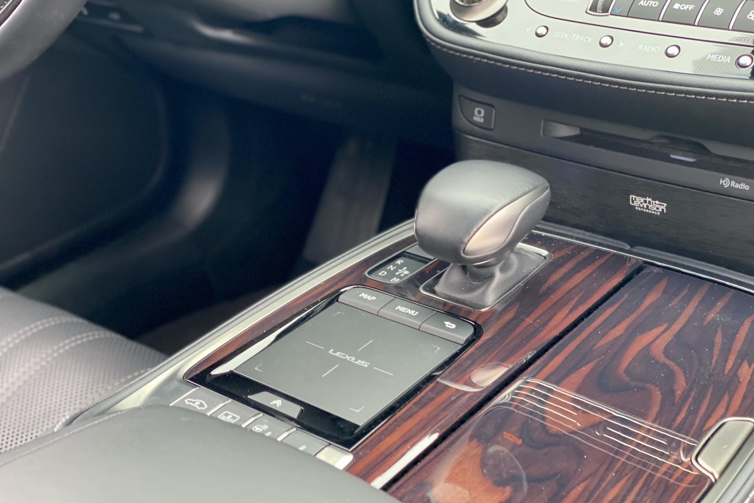 A close-up of the touchpad and shift knob in the 2021 Lexus LS500.