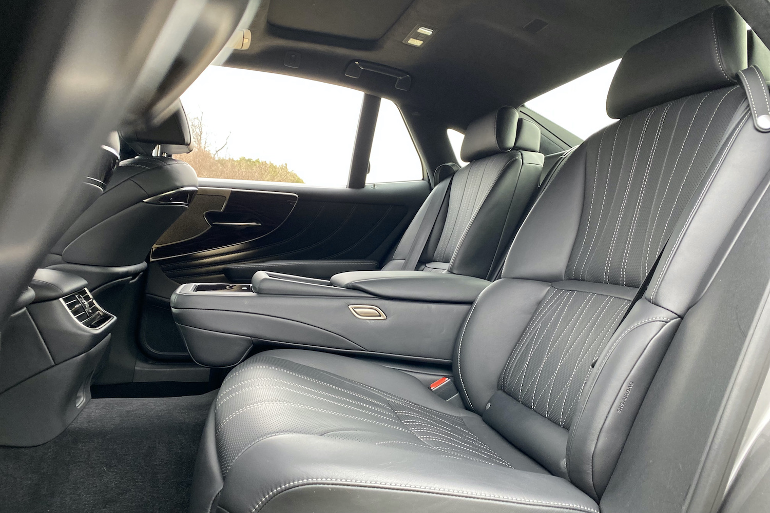 A close-up of rear seats in the 2021 Lexus LS500 from outside the car.