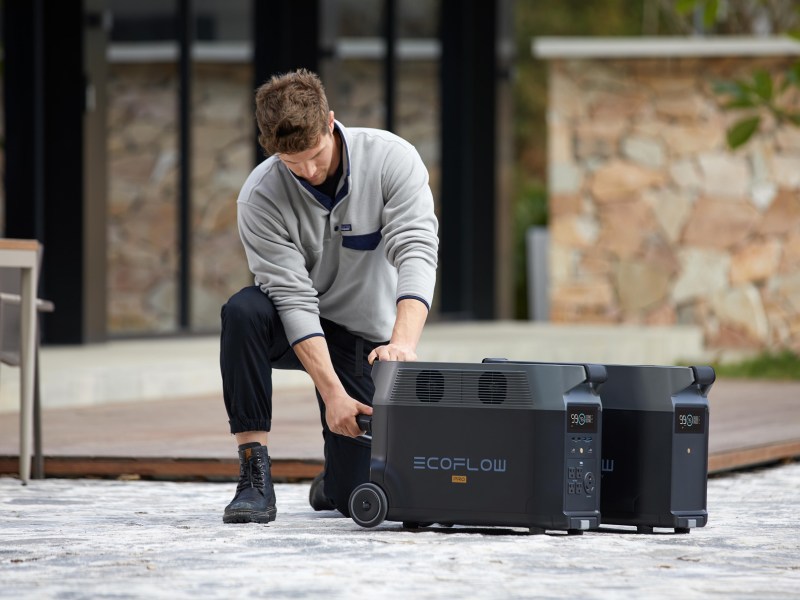 Man moving EcoFlow DELTA Pro ecosystem as needed.