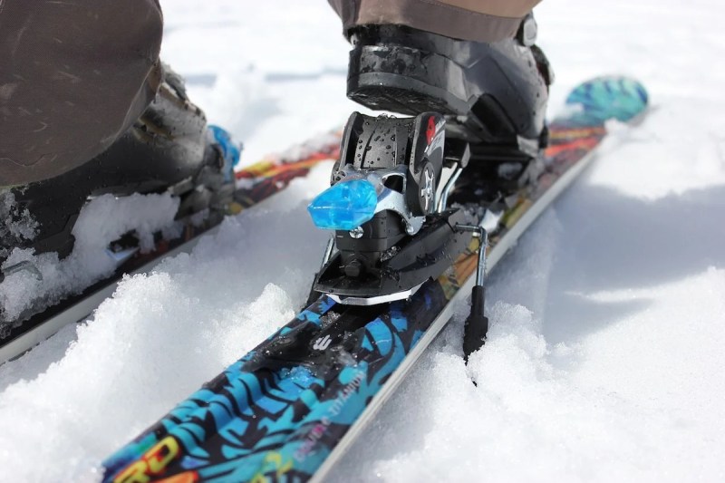Ski boot clipping into binding from behind.