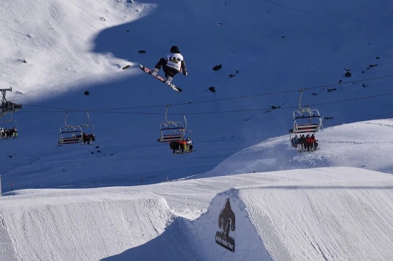 Snowboarder catching some air at the Olympics.