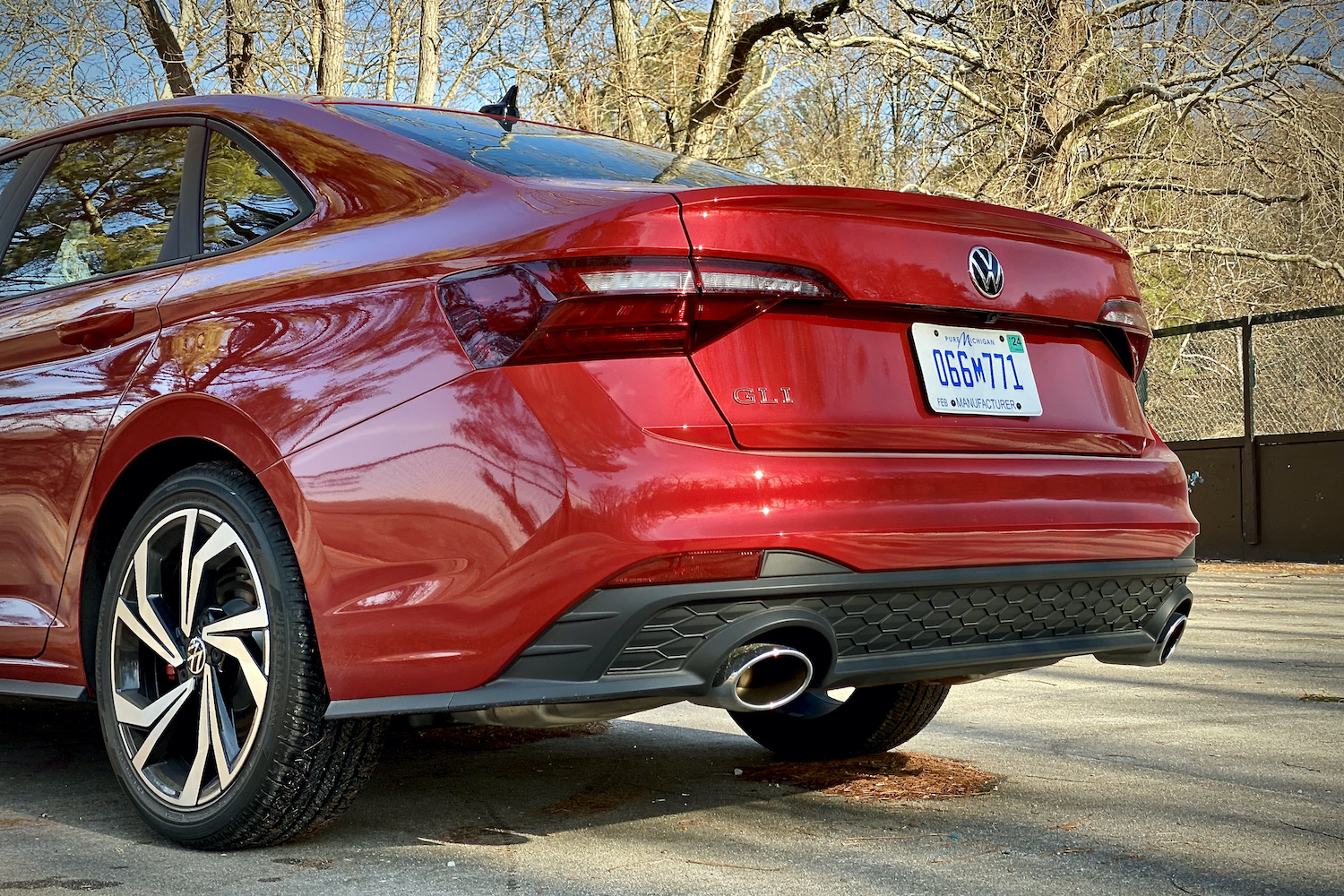 Rear end of 2022 Volkswagen Jetta from the driver's side in a concrete parking lot.