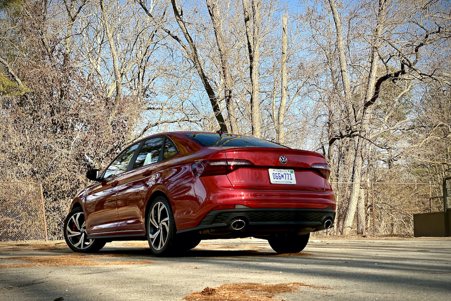 2022 Volkswagen Jetta rear end from the driver's side with trees in the background.