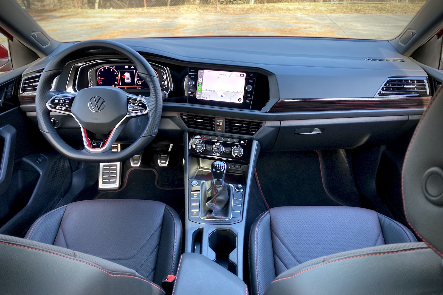 Dashboard and center console in the 2022 Volkswagen Jetta GLI from the rear seats.